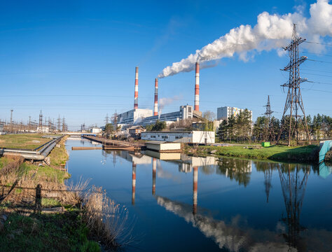 View of a thermal power plant, pipes with smoke
