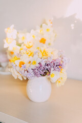 Elegant Floral Arrangement in White Vase Elegant in Pastel Tones