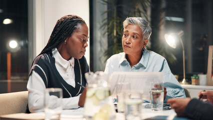 Paperwork, office and business women in meeting for financial review, budget report and feedback. Corporate team, professional and workers with documents for collaboration, strategy and planning