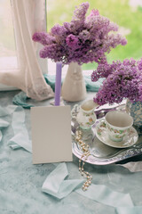 mockup card Elegant Lilac Floral Arrangement with Vintage Accents