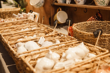 Sale of handmade ceramic Christmas tree toys at the Christmas Fair. Black Friday for the winter...