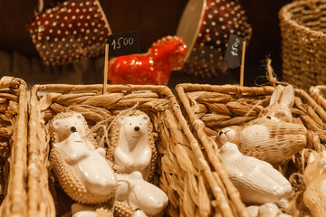 Sale of handmade ceramic Christmas tree toys at the Christmas Fair. Black Friday for the winter...