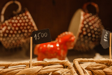 Sale of handmade ceramic Christmas tree toys at the Christmas Fair. Black Friday for the winter...