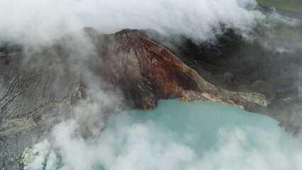 aerial view of the interior of a volcano crater, with a lake of sulphur. Java, Indonesia - 19th March 2025
