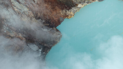 aerial view of the interior of a volcano crater, with a lake of sulphur. Java, Indonesia - 19th March 2025