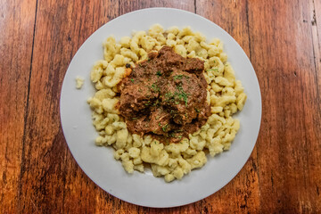 German meal in Pozuzo village, Peru. Goulash with spaetzle.