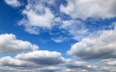 A beautiful blue sky with soft, white clouds, for an abstract background