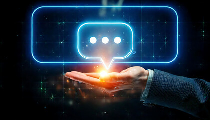 A hand gently cradles a glowing neon speech bubble, symbolizing communication, connection, and digital interaction.