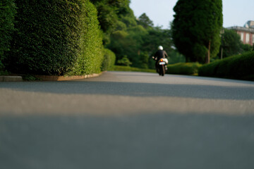 minimal motorcycle on quiet road focused and clear atmosphere