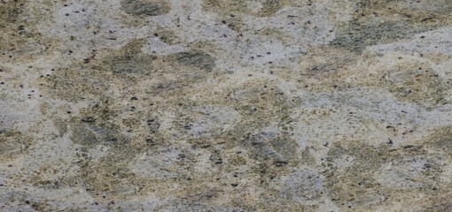 Textured stone surface with various shades of beige, gray, and brown