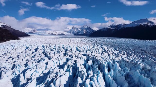 Los Glaciares National Park In El Calafate Santa Cruz Argentina. Glacier Calving Into Icy Lagoon With Snow Capped Mountains. Nature Travel Snow Covered Forest Trees.