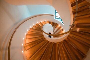 Elegant Spiral Wooden Staircase with Modern Design and Warm Lighting