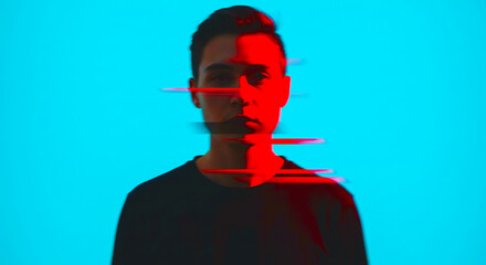 A man with half his face illuminated by red light against a bright blue background with glitch...