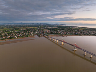 Cua Hoi bridge spans over the calm waters in Vinh city, Nghe An, during twilight hours