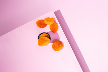 Dried Apricots on Pink Surface