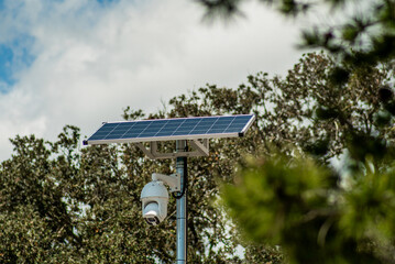 Solar Panel on Pole with Security Camera in Green Park

