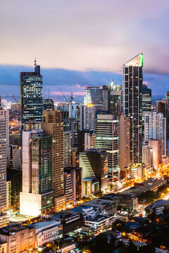 Makati skyline with modern skyscrapers at dusk, Manila, Philippines