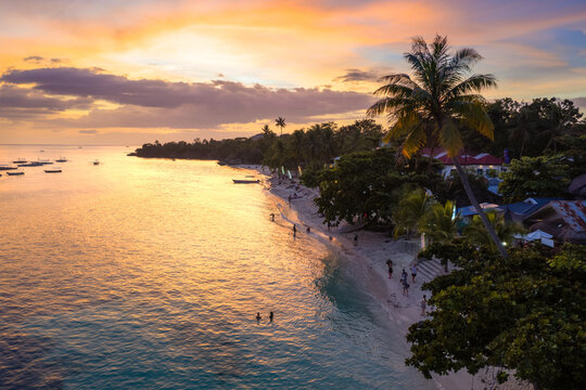 Colorful sunset over Alona beach, Panglao, Bohol, Philippines