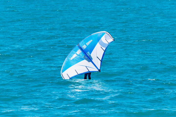 Windsurfer on the sea surface.