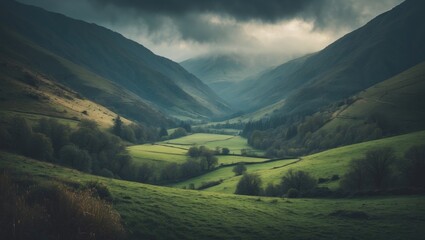 Fototapeta premium Green valley landscape with mountains and cloudy sky. Nature and scenery, peaceful environment. Rural countryside setting with lush greenery and rolling hills.