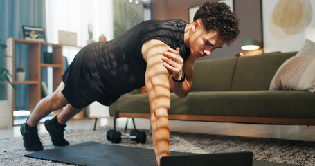 Fitness, laptop and man in home for workout, exercise and training for muscle strength on website....