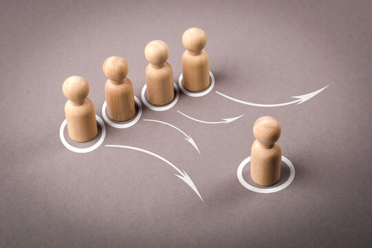 Leadership and Delegation Concept with Wooden Figures and Arrows on Gray Background