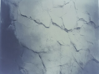 Cracked surface texture displaying abstract patterns in gray tones