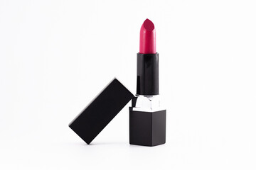 Fototapeta premium Elegant lipstick for evening makeup placed on a clean white background. Perfect for beauty, cosmetics, and skincare themes in advertising or editorial content.
