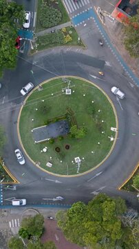 Aerial Ascending Hyperlapse of Roundabout Traffic at Ciudad Jardin. Cali, Colombia. Vertical