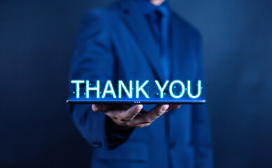 Businessman using laptop and showing thank you message. Concept of congratulation, appreciation, presentation from digital technology. Thank you in business and gratitude.