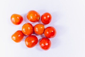 a bunch of red tomatoes in white background