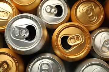 Many different tin cans as background, top view