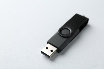 One flash drive on white background, closeup
