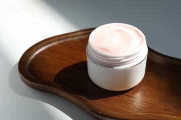 Jar of body cream on white background, closeup