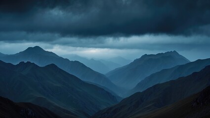 Obraz premium Dark stormy clouds over mountain range with layered peaks and deep valleys, creating a dramatic and moody landscape scene.