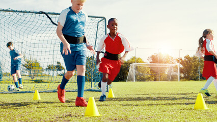 Obraz premium Kids, running and drills for soccer practice for strength training, fitness exercise and sports workout. Children, equipment and resistance for endurance, speed challenge and team for cardio routine