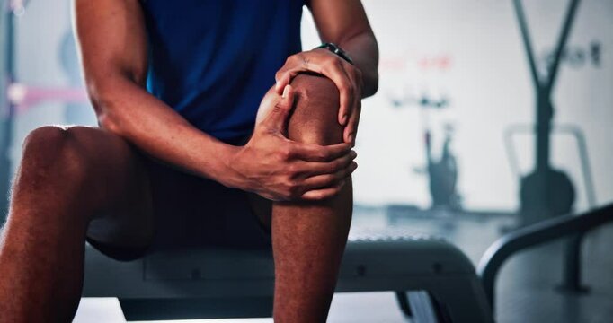 Man, hands or gym with knee injury for muscle tension, sprain or joint inflammation. Closeup, male person or pain with sore leg for dislocation, medical attention or emergency at health club facility