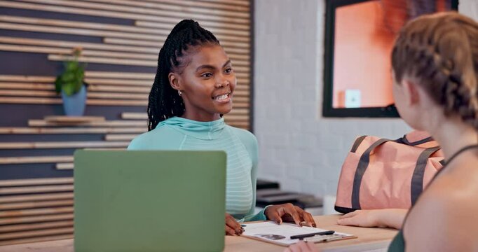 Happy women, gym and receptionist with customer for membership, sign up or quote at front desk. Female people, sales associate or client with laptop or clipboard for member enquiry at health club