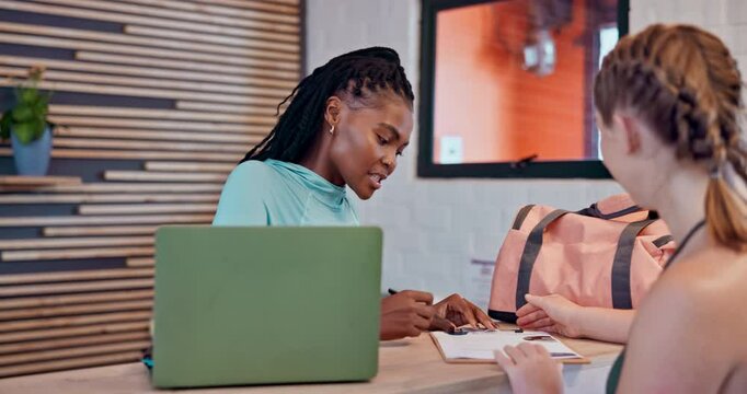 Happy women, gym and receptionist with customer for application, membership or sign up at front desk. People, sales associate or client with form or survey for member policy at health club at laptop