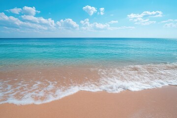 Fototapeta premium Tropical beach with turquoise water and blue sky for travel and vacation backgrounds, wallpapers, and summer designs