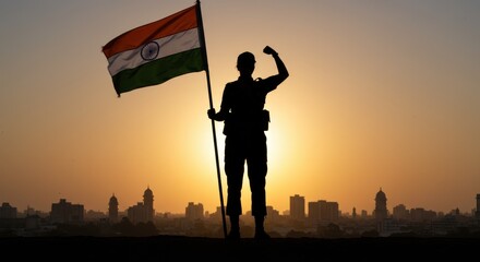 Patriotic silhouette of a soldier standing on rooftop with Indian flag at sunset overlooking city skyline