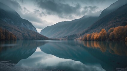 A scenic mountain valley with a calm river, surrounded by forested hills under a cloudy sky.