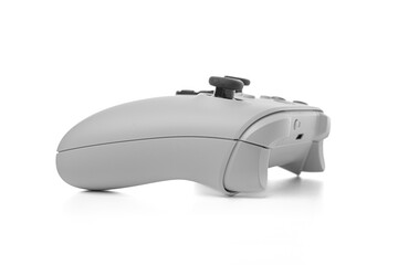 White gaming controller with a symmetrical design, featuring black analog sticks, directional pad,...