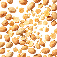 An overhead shot of a scattered assortment of macadamia nuts and pieces
