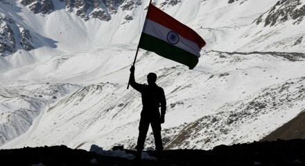 Patriot Standing on Mountain Peak Holding the Indian Flag Amid Snowy Landscape