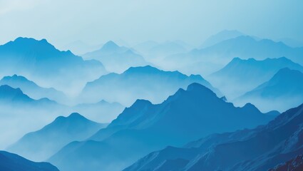 Obraz premium A mountain landscape with misty peaks and layers in blue tones.