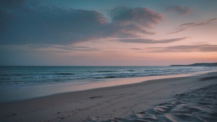A peaceful beach scene at sunset with calm waves and a sandy shoreline.