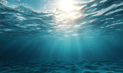 Serene ocean depths tinted pale blue, pierced by shafts of sunlight from the surface