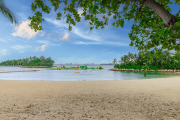 Sentosa Island off the coast from Singapore harbour beautiful white sandy beach and crystal clear turquoise waters 