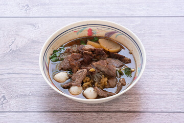 Chinese roll noodle soup with crispy pork